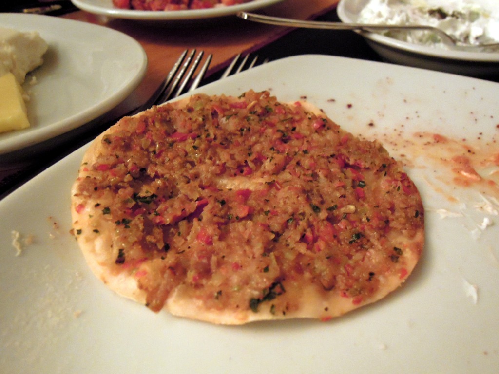 Flatbread topped with ground meat
