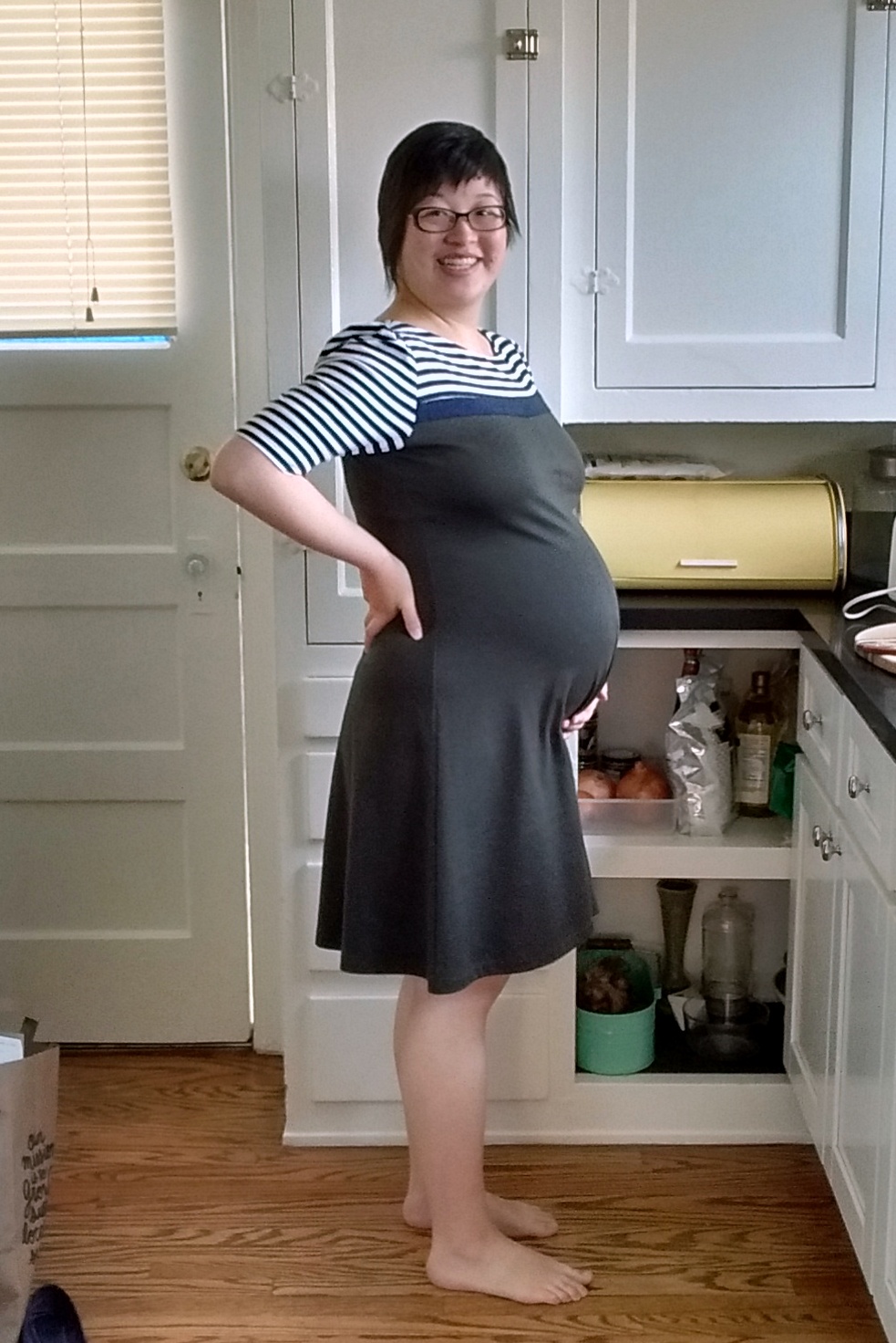 Lisa in her kitchen, 36 weeks pregnant