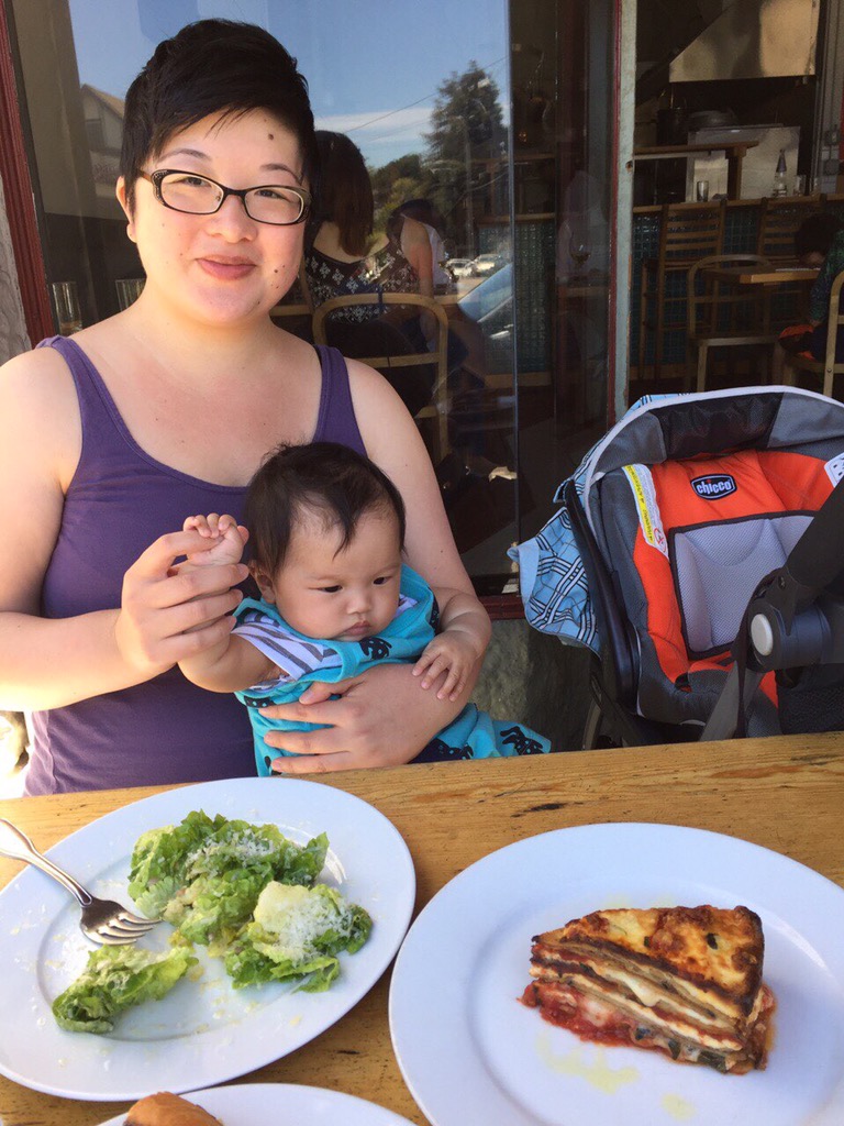 lisa and baby ada having lunch out at a cafe