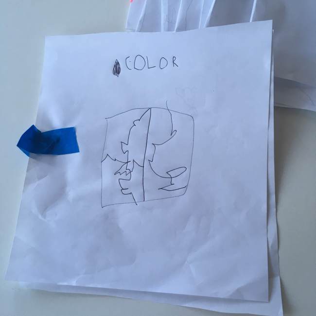 A 4yo's drawing of some open shapes and the word COLOR